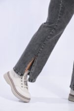 JEAN WIDE ELASTIZADO GRIS CON AVERTURA EN LA BOTA - Imagen 7